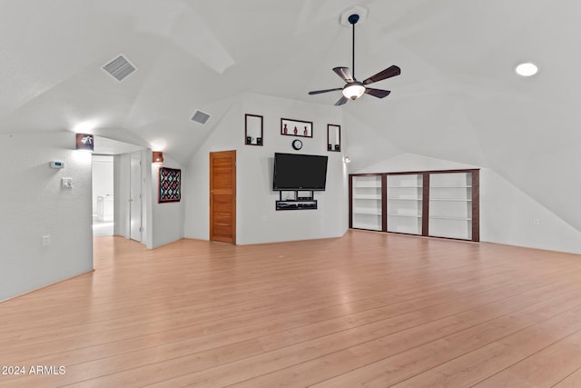 unfurnished living room with ceiling fan, light hardwood / wood-style floors, and lofted ceiling