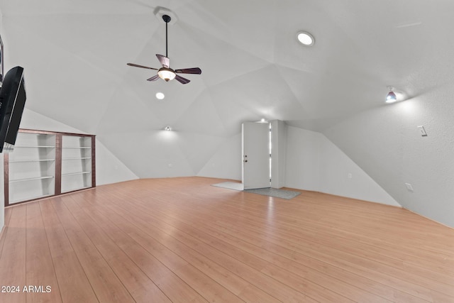 bonus room with light wood-type flooring, ceiling fan, and lofted ceiling