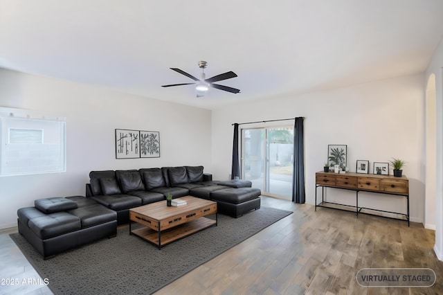 living room with ceiling fan and hardwood / wood-style floors