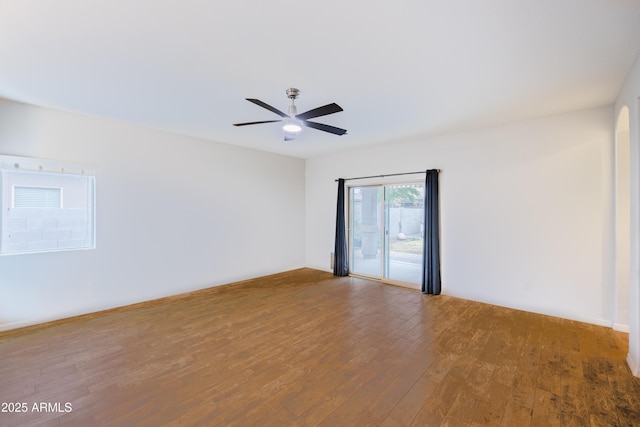 empty room with hardwood / wood-style flooring and ceiling fan