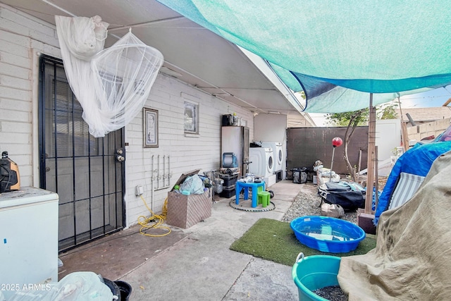 2223 E Roosevelt St, Phoenix, AZ 85006 - view of patio / terrace with washer and clothes dryer and a fenced backyard