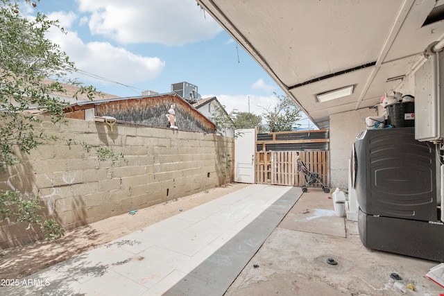 2223 E Roosevelt St, Phoenix, AZ 85006 - view of patio featuring central AC unit and fence