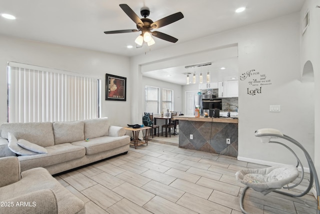 2223 E Roosevelt St, Phoenix, AZ 85006 - living room with recessed lighting, visible vents, ceiling fan, wood finish floors, and arched walkways