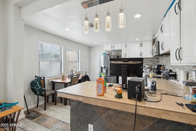 2223 E Roosevelt St, Phoenix, AZ 85006 - kitchen with white cabinetry, tasteful backsplash, pendant lighting, and recessed lighting
