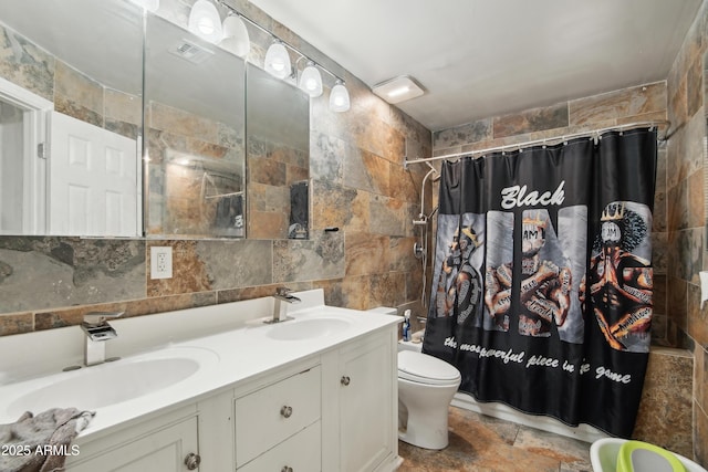 2223 E Roosevelt St, Phoenix, AZ 85006 - full bath with toilet, tile walls, double vanity, and a sink