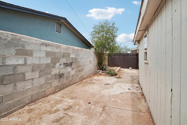 2223 E Roosevelt St, Phoenix, AZ 85006 - view of side of property with a fenced backyard and a patio
