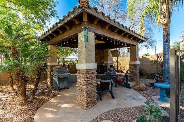 view of patio featuring a gazebo and a grill