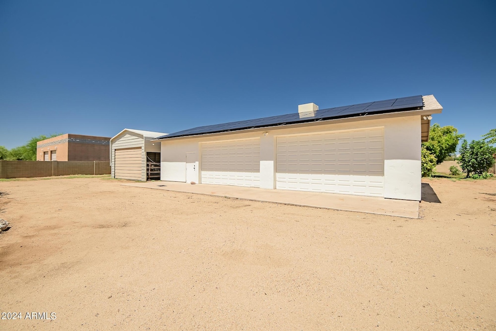 garage featuring solar panels