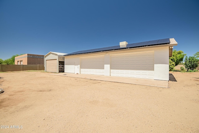 garage featuring solar panels