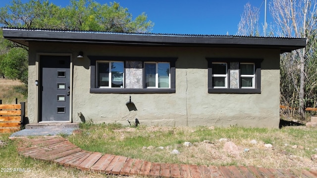 view of front of house featuring stucco siding