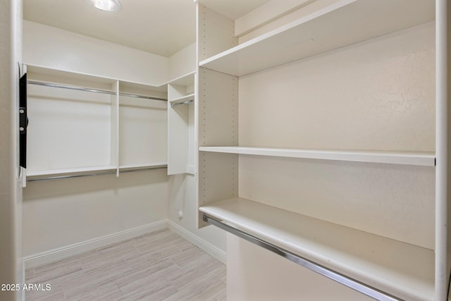 654 E County Down Dr, Chandler, AZ 85249 - walk in closet featuring light wood-type flooring