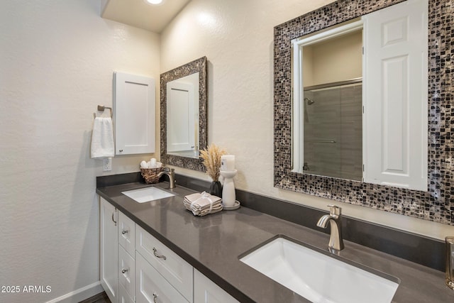 654 E County Down Dr, Chandler, AZ 85249 - bathroom with double vanity, tiled shower, and a textured wall