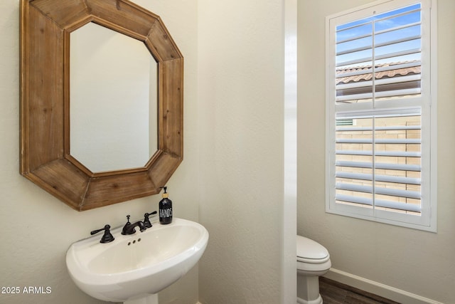 654 E County Down Dr, Chandler, AZ 85249 - bathroom featuring a sink, wood finished floors, baseboards, and toilet