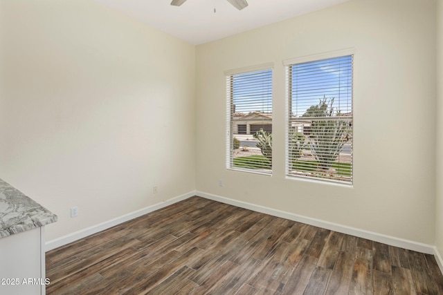 654 E County Down Dr, Chandler, AZ 85249 - spare room featuring dark wood-style flooring, baseboards, and a ceiling fan