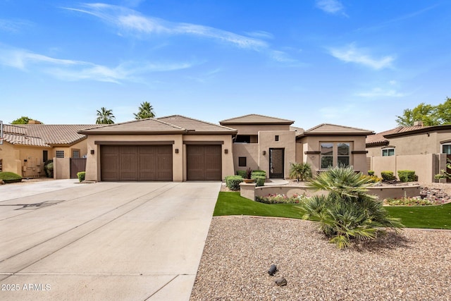 654 E County Down Dr, Chandler, AZ 85249 - view of front facade featuring an attached garage, stucco siding, concrete driveway, and a tiled roof