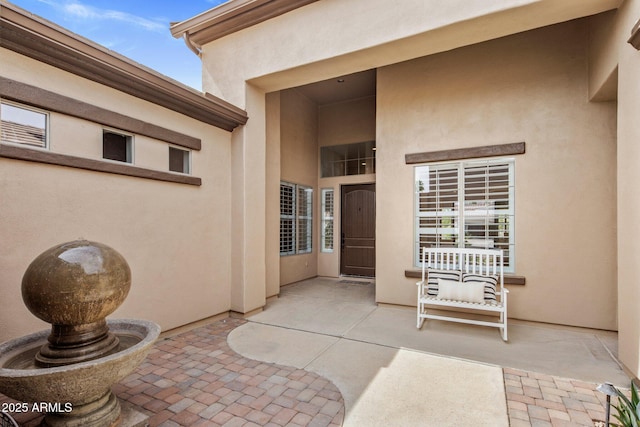 654 E County Down Dr, Chandler, AZ 85249 - property entrance with a patio area and stucco siding