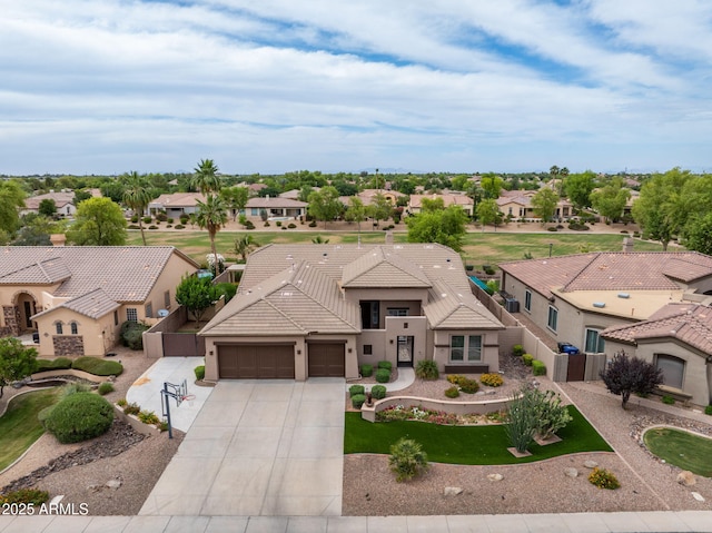 654 E County Down Dr, Chandler, AZ 85249 - view of front of house with a residential view, a garage, driveway, a tiled roof, and stucco siding