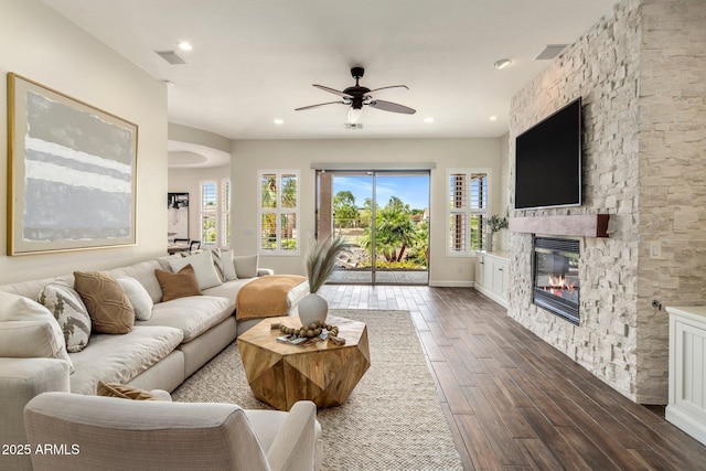 654 E County Down Dr, Chandler, AZ 85249 - living room with ceiling fan, dark wood-style flooring, a fireplace, recessed lighting, and baseboards