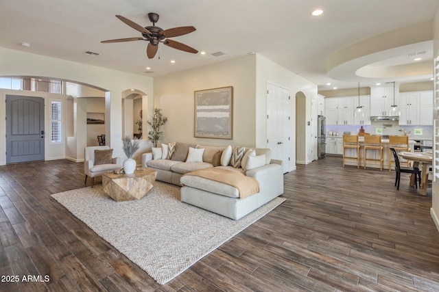 654 E County Down Dr, Chandler, AZ 85249 - living room with arched walkways, ceiling fan, dark wood-type flooring, recessed lighting, and baseboards
