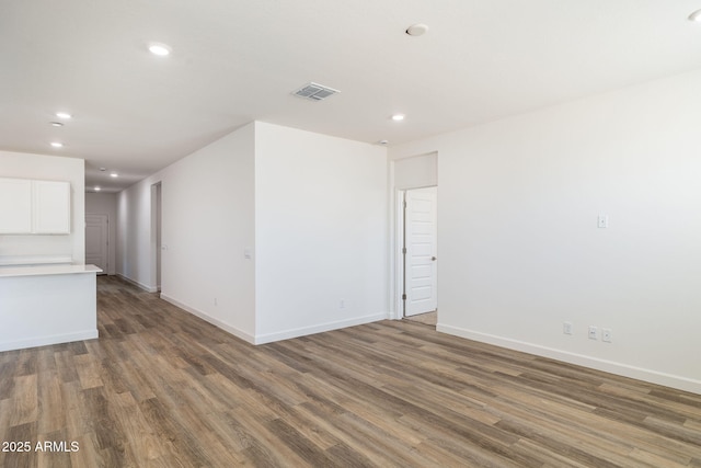 17778 W Turquoise Ave, Waddell, AZ 85355 - empty room featuring recessed lighting, wood finished floors, and baseboards