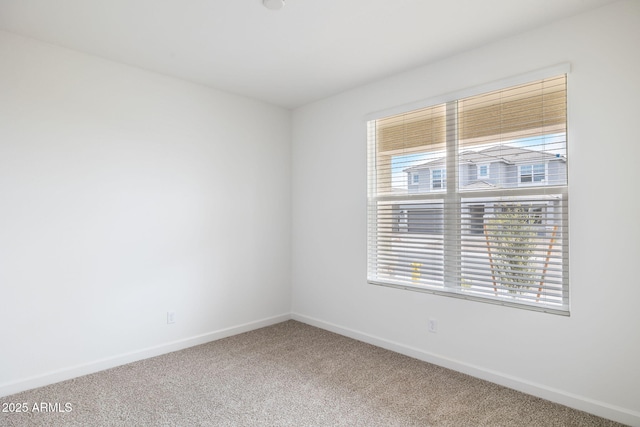 17778 W Turquoise Ave, Waddell, AZ 85355 - empty room with plenty of natural light, carpet flooring, and baseboards