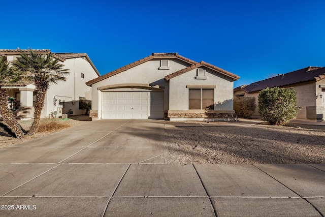 mediterranean / spanish-style home featuring a garage