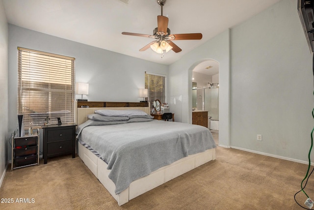 carpeted bedroom with ceiling fan and connected bathroom