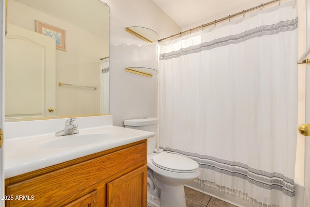 bathroom featuring tile patterned floors, vanity, and toilet