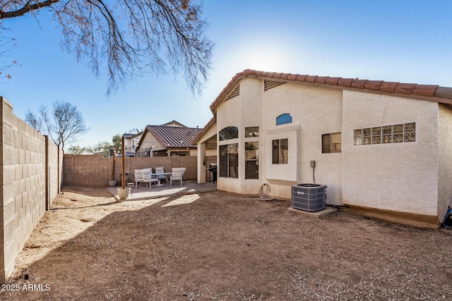 rear view of property with a patio area and an outdoor hangout area