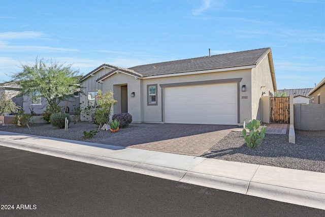 ranch-style home featuring a garage