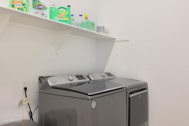 laundry room with separate washer and dryer