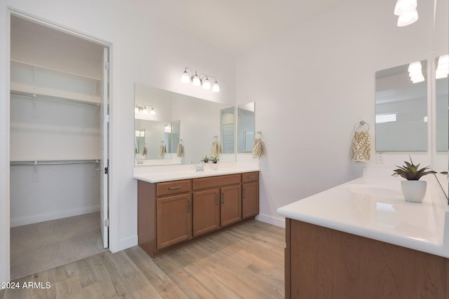 bathroom featuring vanity and wood-type flooring