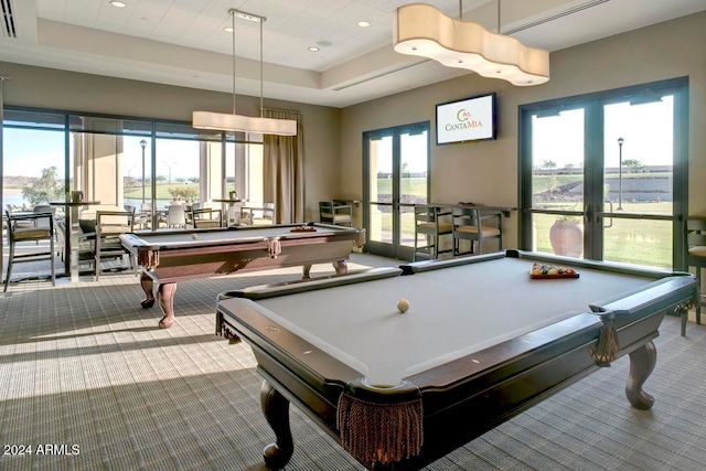 game room featuring light colored carpet, billiards, and a raised ceiling