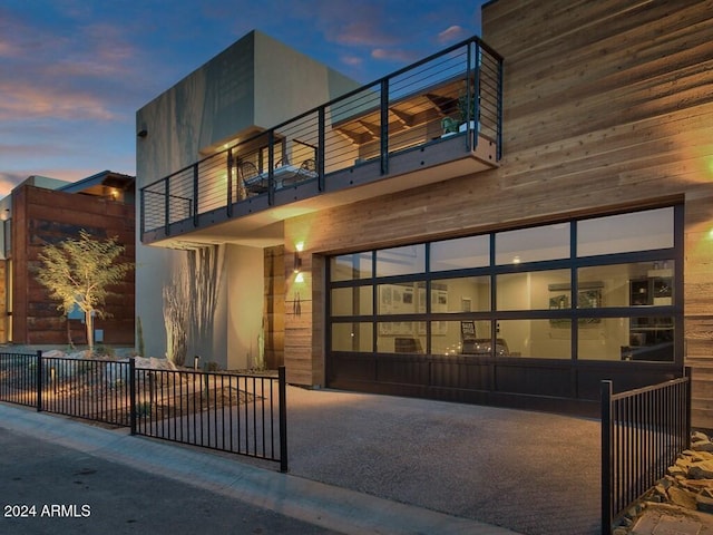 view of front of home featuring a balcony