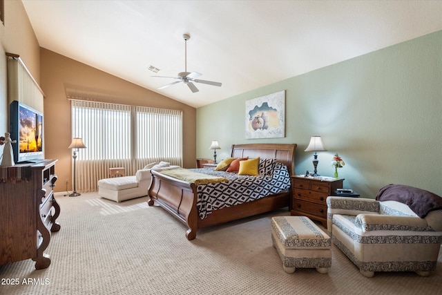 carpeted bedroom with vaulted ceiling and ceiling fan