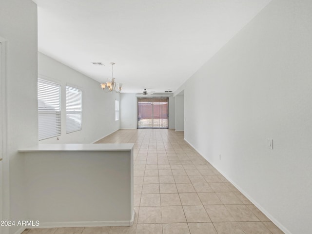 11168 E Lost Canyon Ct, Gold Canyon, AZ 85118 - kitchen featuring hanging light fixtures, light tile patterned flooring, and ceiling fan with notable chandelier