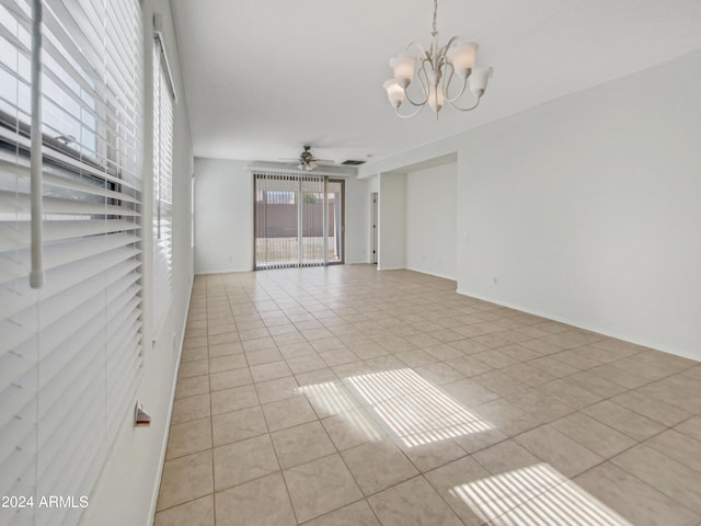 11168 E Lost Canyon Ct, Gold Canyon, AZ 85118 - empty room with light tile patterned floors and ceiling fan with notable chandelier