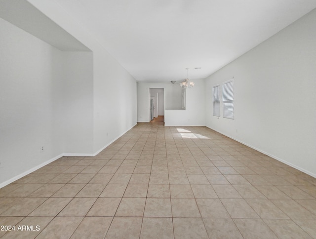 11168 E Lost Canyon Ct, Gold Canyon, AZ 85118 - unfurnished living room featuring a chandelier and light tile patterned flooring