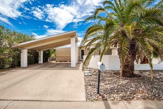 exterior space featuring a carport