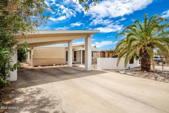 view of patio / terrace featuring a carport