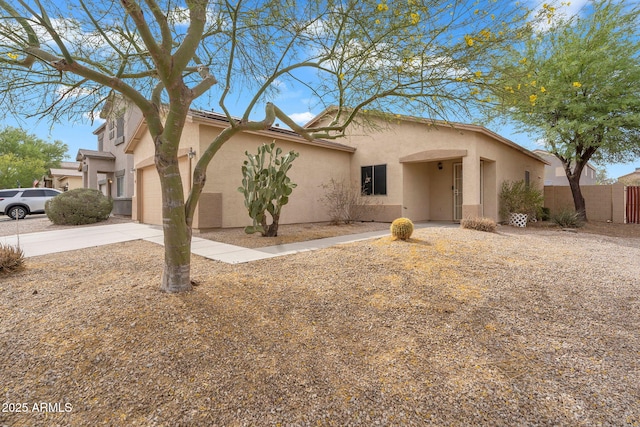 5570 E Quiet Retreat, Florence, AZ 85132 - view of front of house featuring stucco siding, driveway, and an attached garage