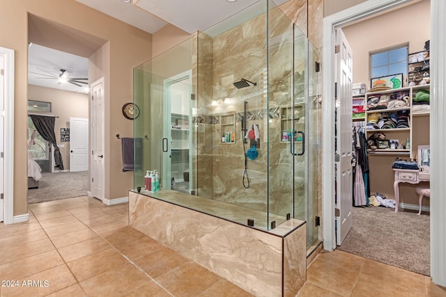 bathroom with walk in shower, tile patterned floors, and ceiling fan