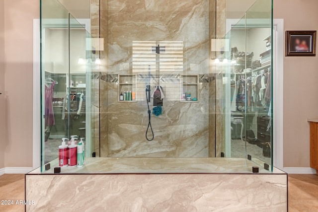 bathroom with tile patterned floors and a shower with shower door