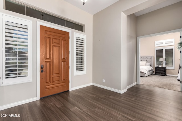 foyer with dark hardwood / wood-style floors