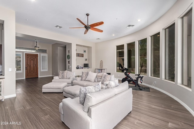 living room with hardwood / wood-style flooring and ceiling fan