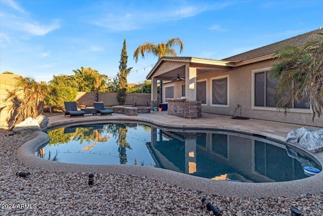 view of pool featuring a patio and ceiling fan