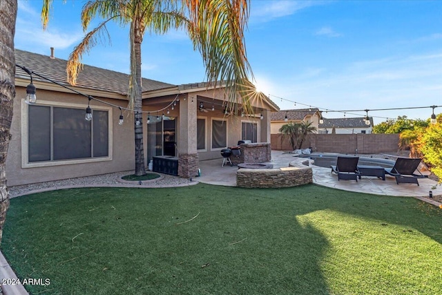 back of house with a lawn and a patio area