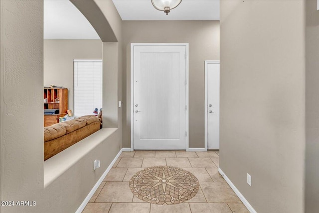 entryway featuring light tile patterned floors