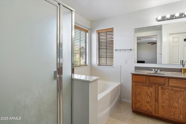 17802 N 114th Ln, Surprise, AZ 85378 - full bathroom featuring a stall shower, tile patterned flooring, a garden tub, and vanity