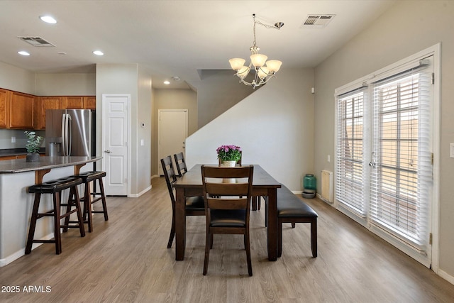 17802 N 114th Ln, Surprise, AZ 85378 - dining room featuring a chandelier, light wood-style flooring, baseboards, and recessed lighting